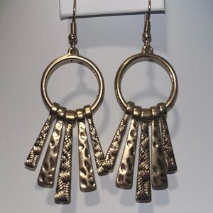 Gold-toned dangle earrings with a hammered and textured finish